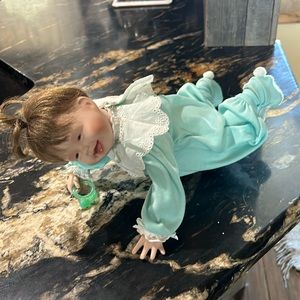 Kathy Hippensteel baby with slippers and pacifier